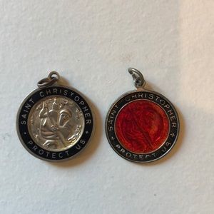 Two Saint Christopher medals.